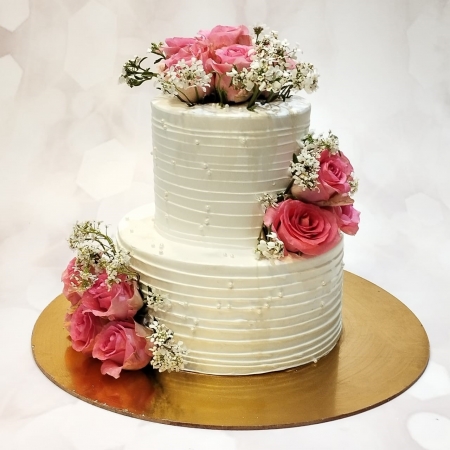 pink roses and white pearl wedding cake
