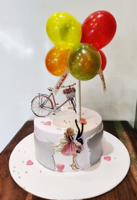 GIRL WITH BICYCLE THEME CAKE